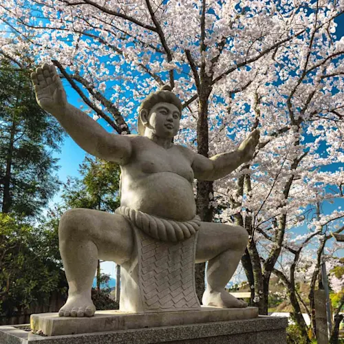 Historical-Japanese-Sumo-shrine-statue-located-in-the-Yamanobe-no-Michi-trail-in-the-Kansai-province-Japan