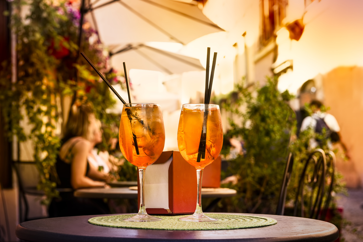 Two glasses of Aperol spritz cocktails at cafe