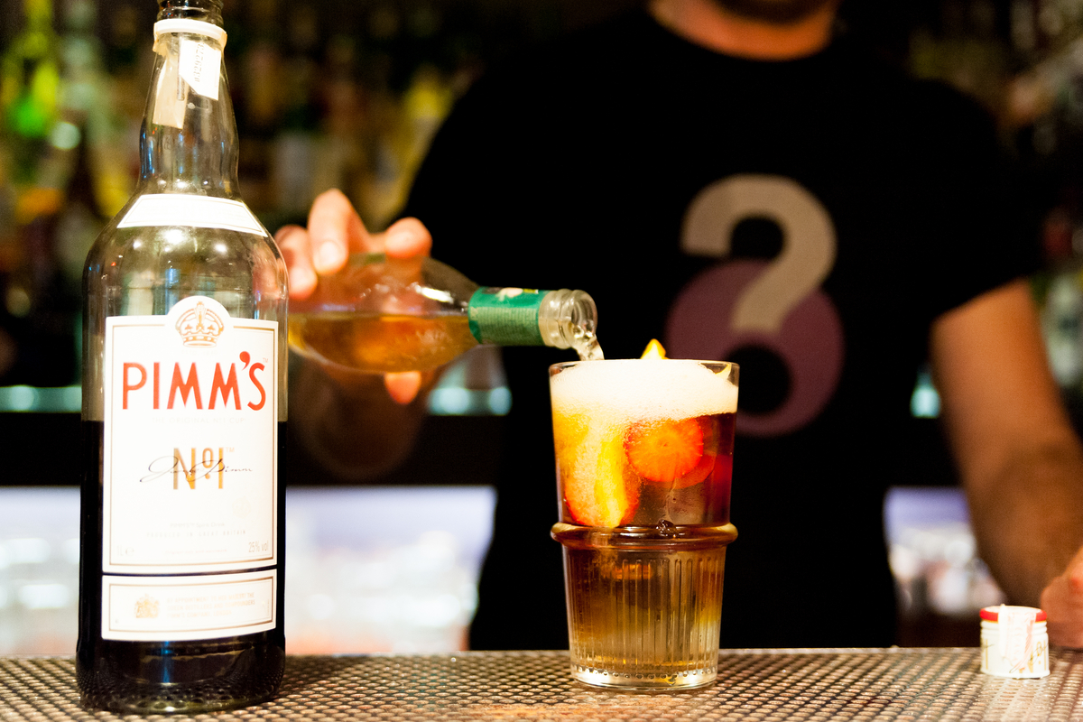 Bottle of Pimm's No.1 Cup and Pimm's Cup on bar counter cocktails